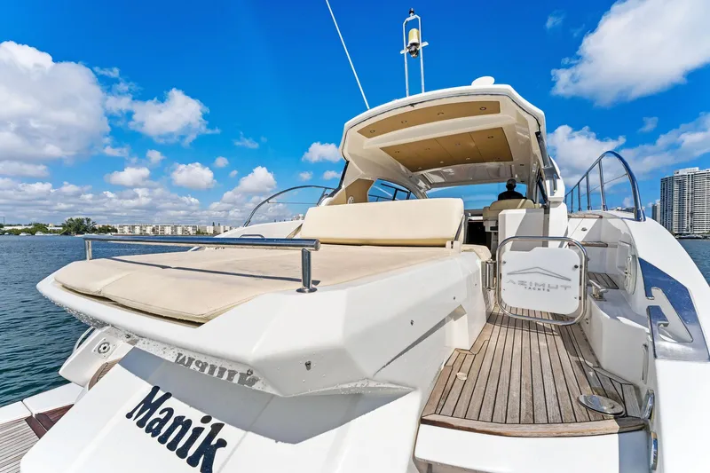Manik Yacht Photos Pics 2016 Azimut Atlantis 50 yacht with spacious deck, cruising on a sunny day.