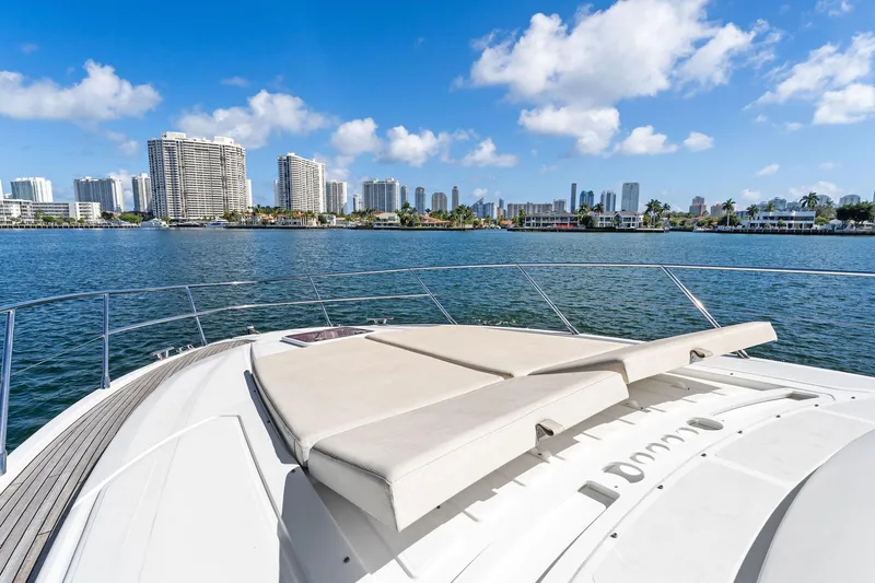 Manik Yacht Photos Pics Azimut Atlantis 50 yacht, 2016, with city skyline and blue sky background.