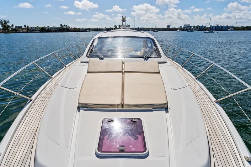 Manik Yacht Photos Pics 2016 Azimut Atlantis 50 yacht on serene water, featuring spacious sunbathing deck.