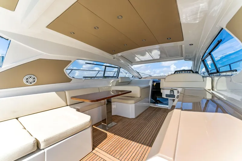 Manik Yacht Photos Pics Luxurious interior of 2016 Azimut Atlantis 50 yacht with modern seating and wooden flooring.