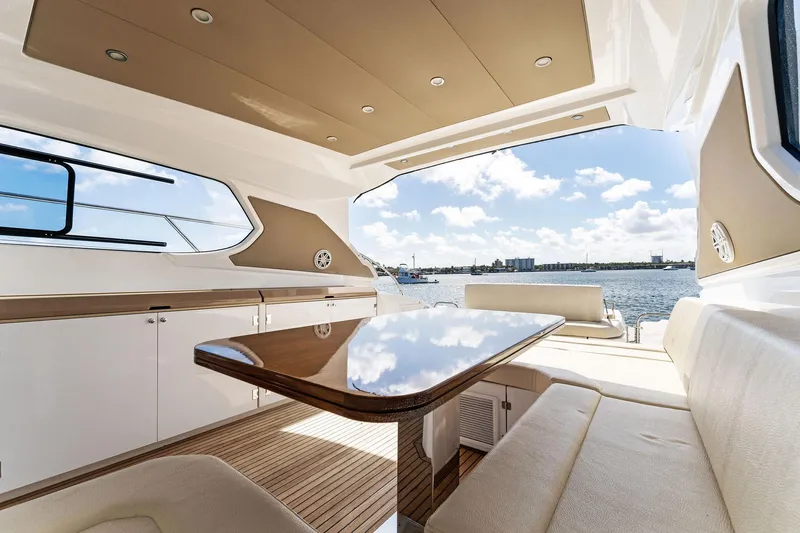 Manik Yacht Photos Pics Luxurious interior of 2016 Azimut Atlantis 50 yacht with elegant seating and table.