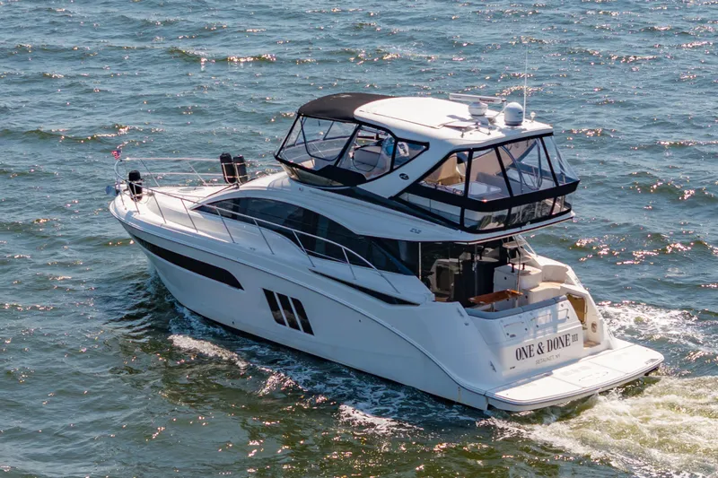 Yacht Photos Pics 2017 Sea Ray Fly 510 yacht cruising on open water, rear view.