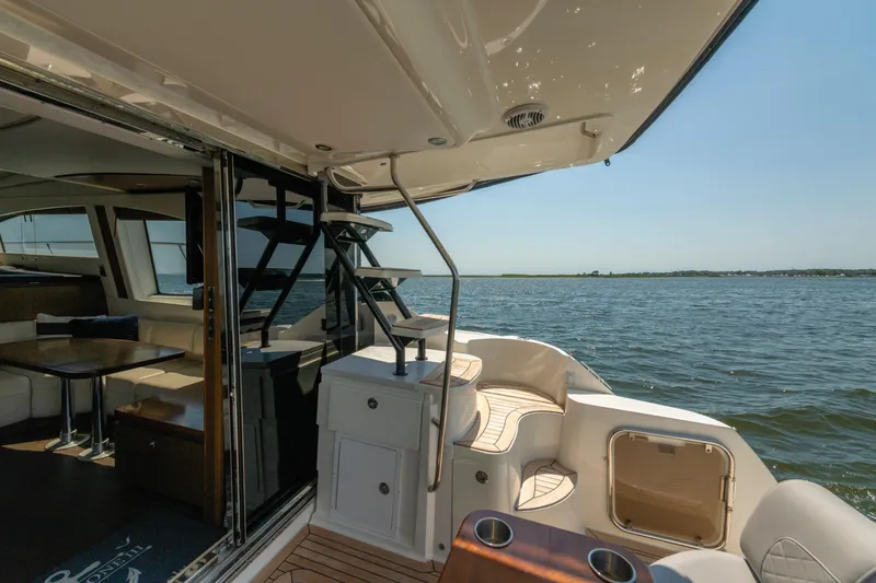  Yacht Photos Pics 2017 Sea Ray Fly 510 yacht interior with ocean view, featuring elegant seating and modern design.