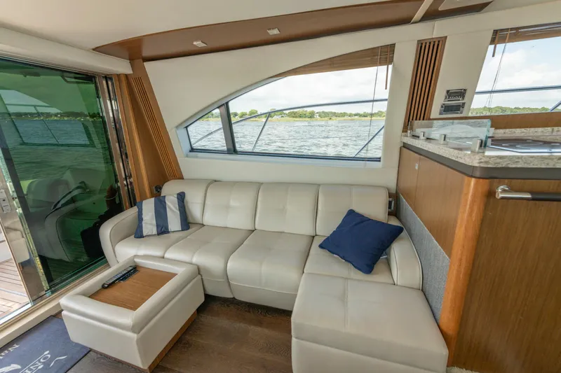  Yacht Photos Pics Luxurious interior of 2017 Sea Ray Fly 510 yacht with plush seating and scenic window view.