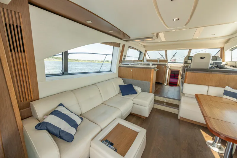  Yacht Photos Pics Luxurious interior of 2017 Sea Ray Fly 510 yacht with elegant seating and modern design.