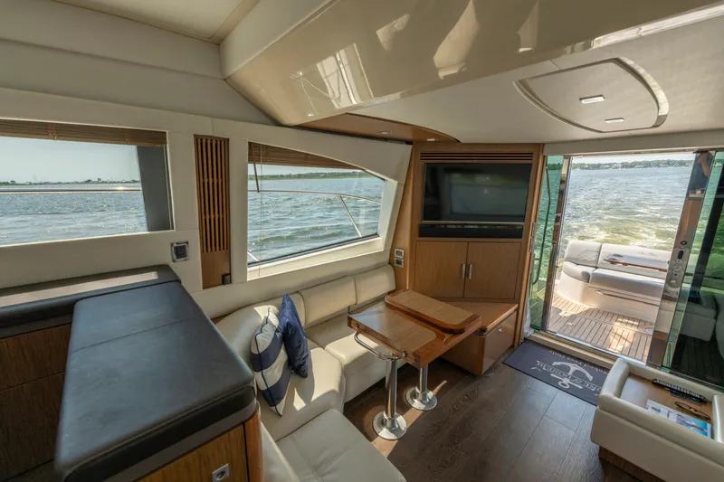  Yacht Photos Pics Luxurious interior of 2017 Sea Ray Fly 510 yacht with elegant seating and scenic water views.