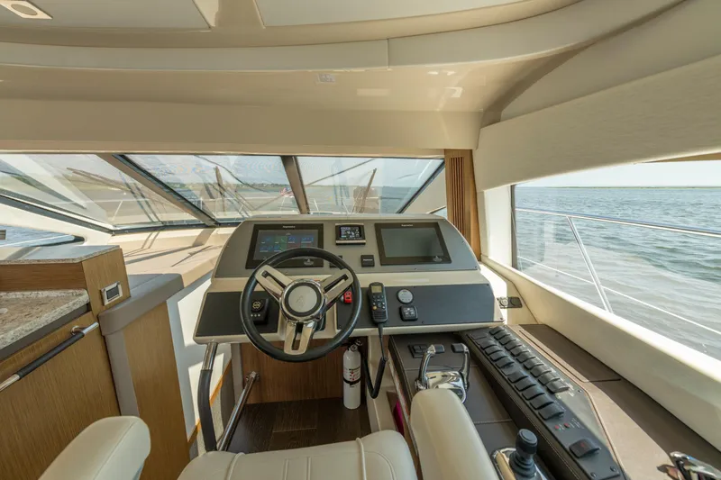  Yacht Photos Pics 2017 Sea Ray Fly 510 yacht helm with modern controls and panoramic ocean view.