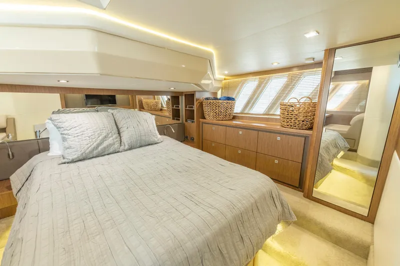  Yacht Photos Pics Luxurious bedroom interior of 2017 Sea Ray Fly 510 yacht with modern design elements.
