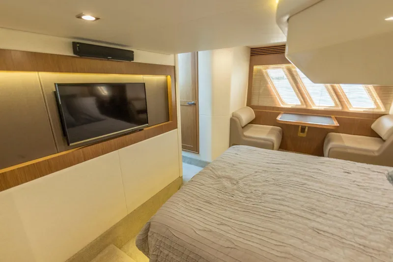  Yacht Photos Pics Luxurious interior of 2017 Sea Ray Fly 510 yacht with TV and seating area.