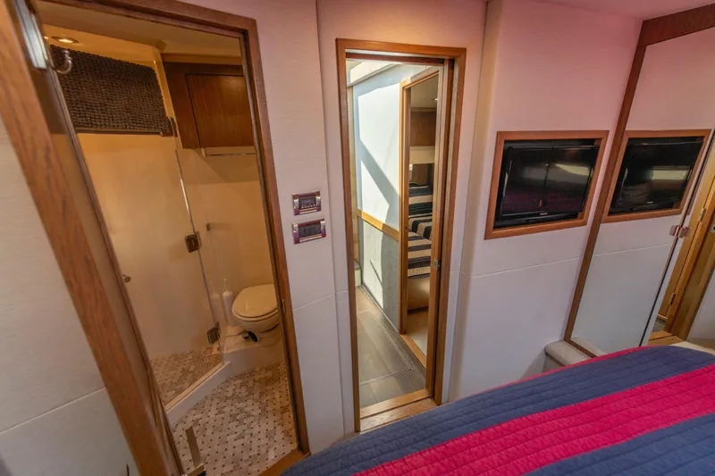  Yacht Photos Pics Luxurious interior of 2017 Sea Ray Fly 510 yacht featuring bathroom and bedroom.