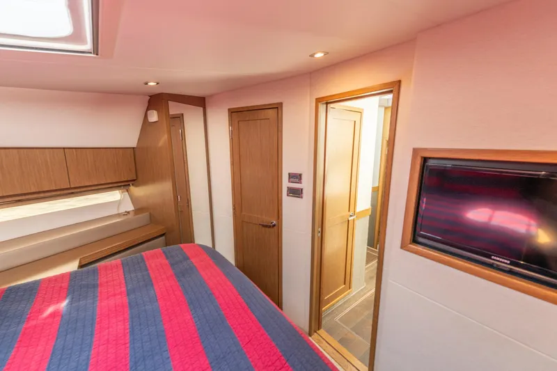  Yacht Photos Pics Luxurious 2017 Sea Ray Fly 510 yacht bedroom with modern wood finishes and TV.