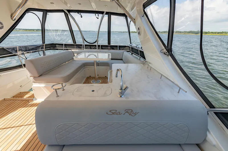  Yacht Photos Pics Luxurious interior of 2017 Sea Ray Fly 510 yacht with elegant seating and panoramic windows.