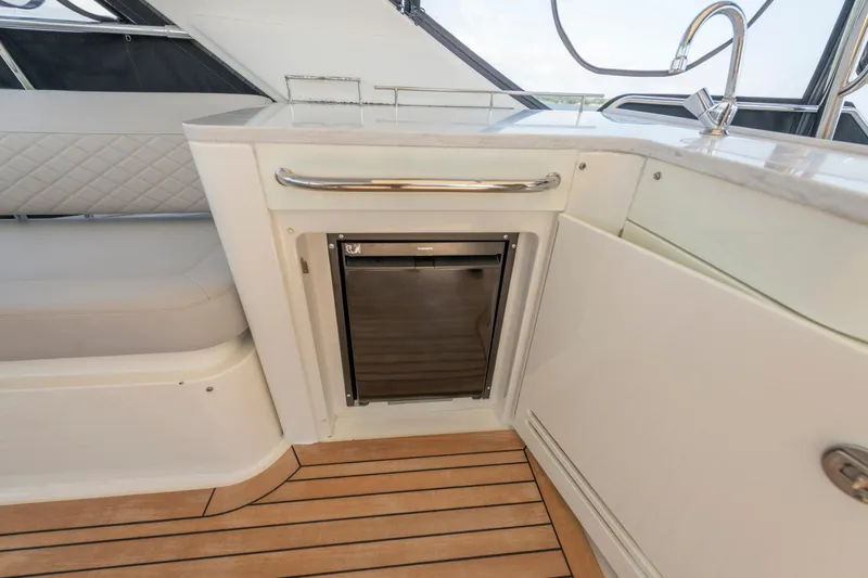  Yacht Photos Pics Luxurious interior of 2017 Sea Ray Fly 510 yacht with sleek kitchenette design.