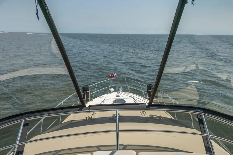  Yacht Photos Pics 2017 Sea Ray Fly 510 yacht cruising on open water, view from the helm.