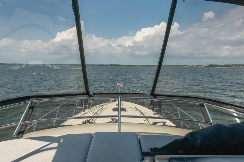  Yacht Photos Pics 2017 Sea Ray Fly 510 yacht cruising on open water under a clear sky.