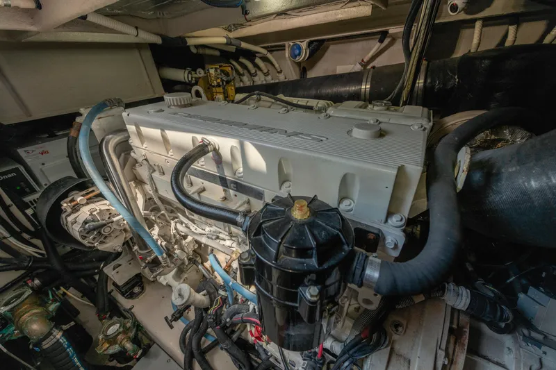  Yacht Photos Pics Engine room of a 2017 Sea Ray Fly 510 yacht, showcasing detailed machinery.