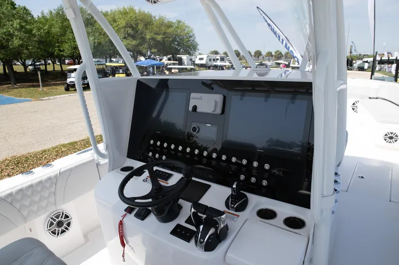  Yacht Photos Pics 2024 Contender 39 ST boat dashboard with steering wheel and controls.