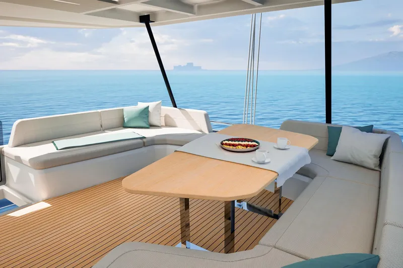 Yacht Photos Pics Luxurious 2026 Fountaine Pajot FP 55 yacht deck with elegant seating and ocean view.