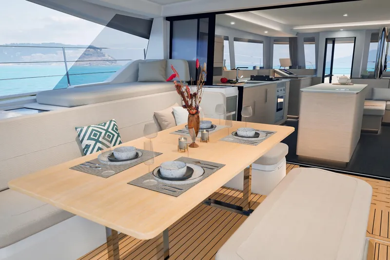 Yacht Photos Pics Luxurious interior of 2026 Fountaine Pajot FP 55 yacht with elegant dining area.