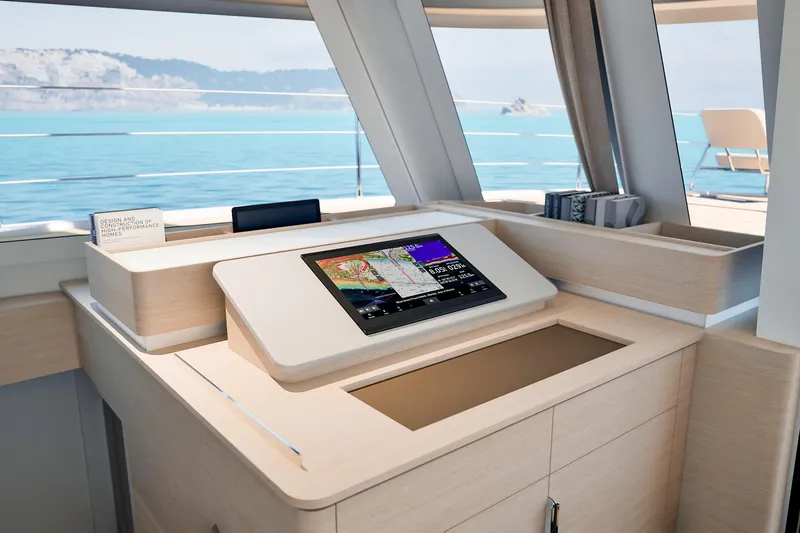  Yacht Photos Pics Modern navigation station on 2026 Fountaine Pajot FP 55 yacht with ocean view.