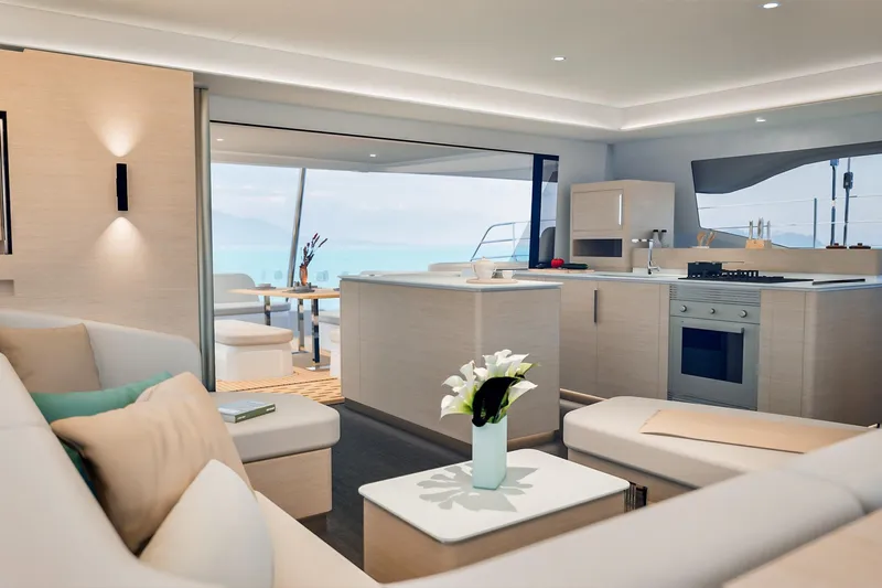  Yacht Photos Pics Luxurious interior of 2026 Fountaine Pajot FP 55 yacht with modern kitchen and seating area.