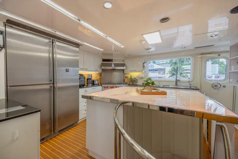 Entourage Yacht Photos Pics Modern kitchen in a 1994 Norship Pilot House yacht with stainless steel appliances.
