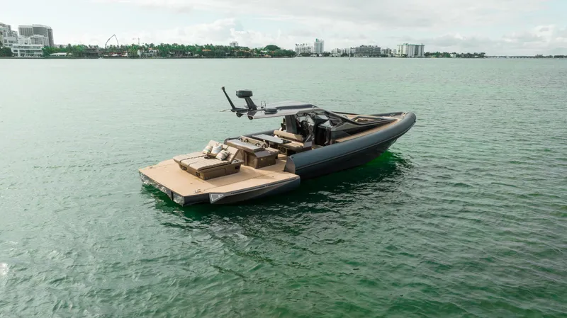  Yacht Photos Pics Anvera 48 - USA 2025 luxury boat on calm water, showcasing sleek design and spacious deck.