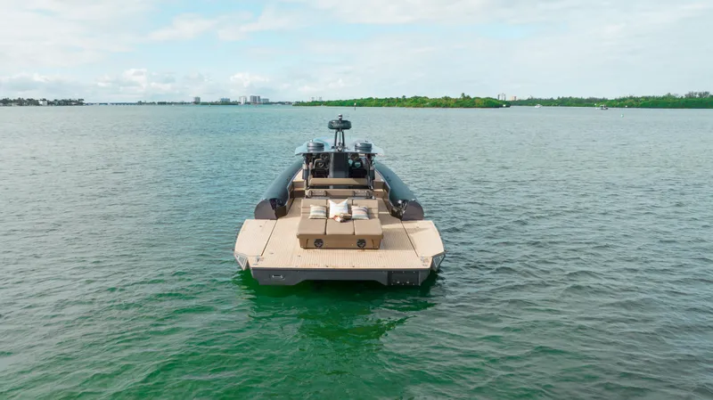  Yacht Photos Pics Anvera 48 - USA 2025 luxury boat on calm water, rear view.