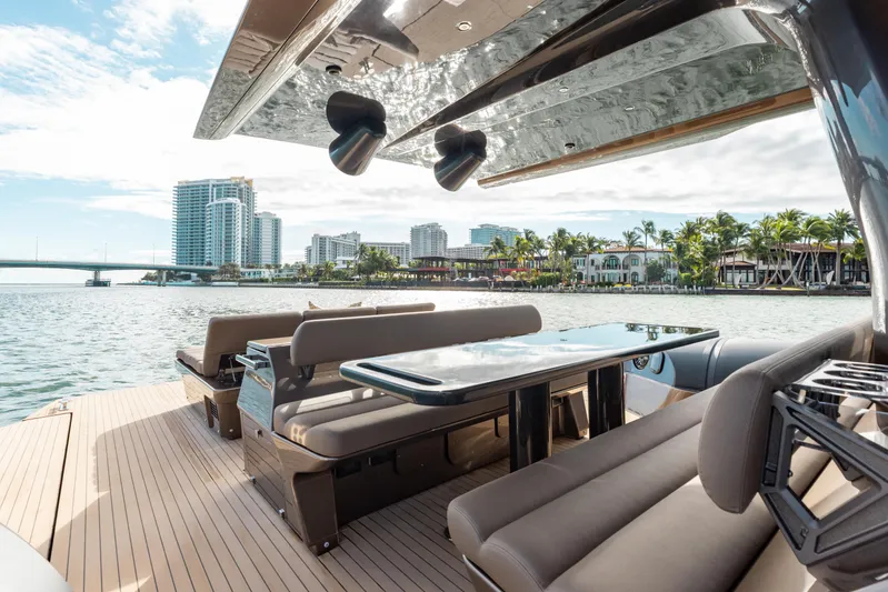  Yacht Photos Pics Luxurious Anvera 48 yacht deck with seating, overlooking waterfront cityscape, 2025 model.