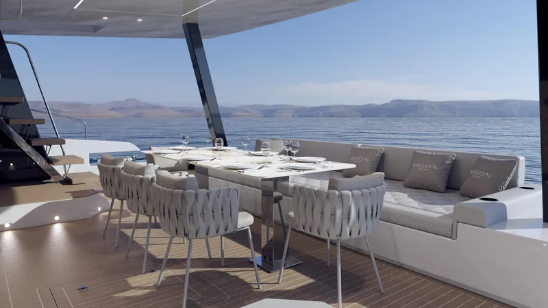  Yacht Photos Pics Luxurious dining area on Moon 60 Power yacht, 2025 model, overlooking serene ocean views.
