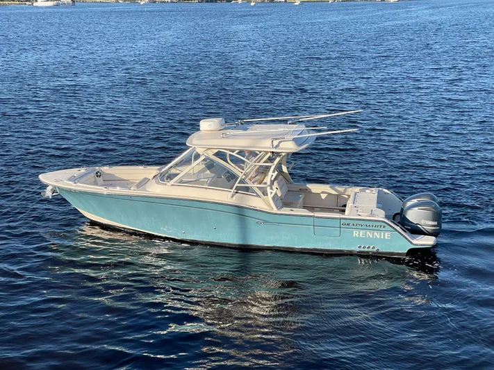 Rennie Yacht Photos Pics 2019 Grady-White Freedom 325 boat on calm blue water.
