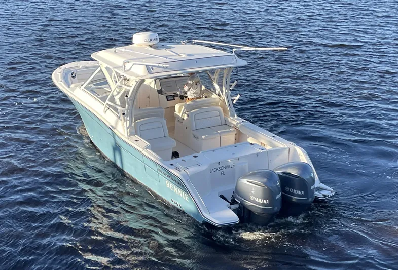 Rennie Yacht Photos Pics 2019 Grady-White Freedom 325 boat with twin Yamaha engines on open water.
