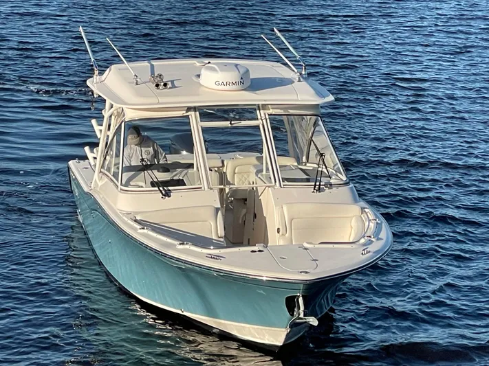 Rennie Yacht Photos Pics 2019 Grady-White Freedom 325 boat on water, featuring Garmin equipment.
