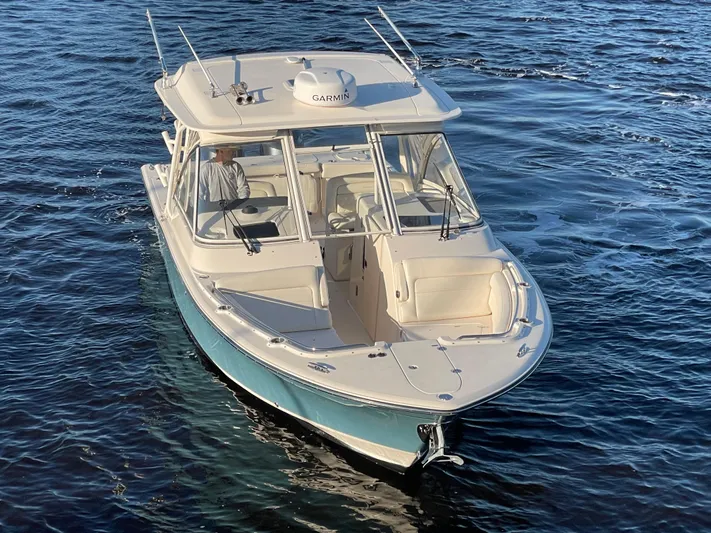 Rennie Yacht Photos Pics 2019 Grady-White Freedom 325 boat cruising on open water.