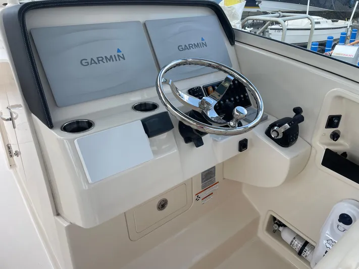 Rennie Yacht Photos Pics 2019 Grady-White Freedom 325 helm with Garmin displays and steering wheel.