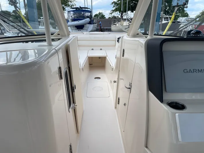Rennie Yacht Photos Pics 2019 Grady-White Freedom 325 boat interior with Garmin navigation system.