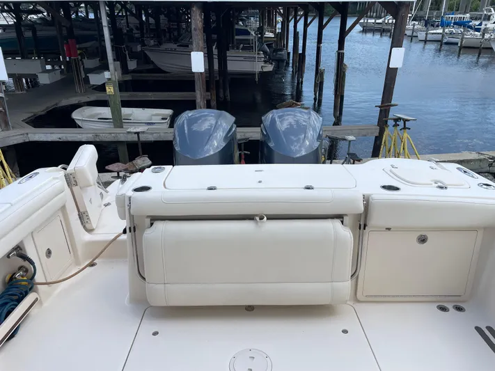 Rennie Yacht Photos Pics 2019 Grady-White Freedom 325 boat docked, featuring dual outboard engines.