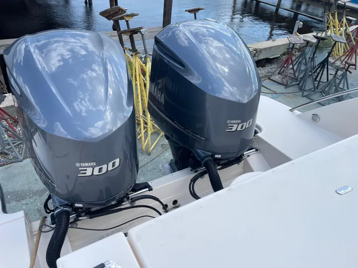 Rennie Yacht Photos Pics Twin Yamaha 300 engines on a 2019 Grady-White Freedom 325 boat by the water.
