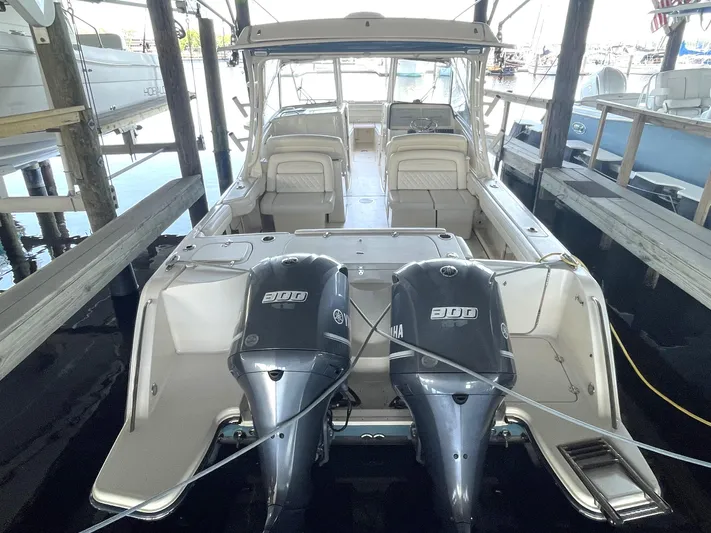 Rennie Yacht Photos Pics 2019 Grady-White Freedom 325 boat with dual 300 horsepower engines docked in marina.