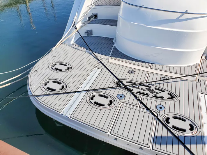  Yacht Photos Pics 1997 Sea Ray 580 Super Sun Sport yacht deck with mooring lines and logo.