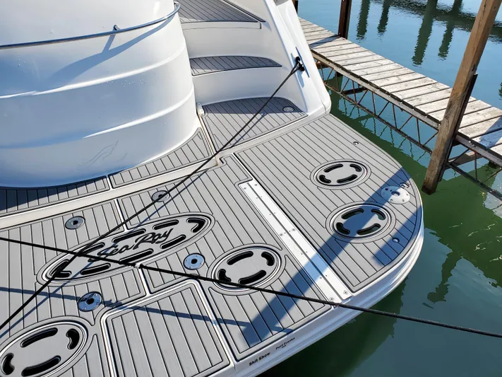  Yacht Photos Pics 1997 Sea Ray 580 Super Sun Sport yacht with sleek deck design at marina.