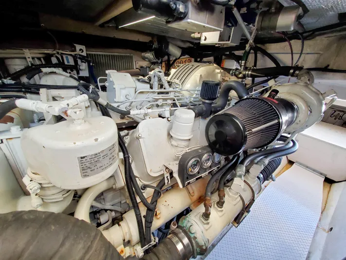  Yacht Photos Pics Engine room of a 1997 Sea Ray 580 Super Sun Sport yacht, showcasing mechanical components.