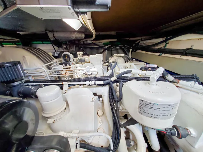  Yacht Photos Pics Engine room of a 1997 Sea Ray 580 Super Sun Sport yacht, showcasing mechanical components.