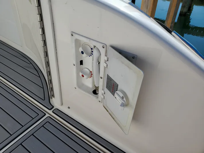  Yacht Photos Pics 1997 Sea Ray 580 Super Sun Sport boat deck with open utility panel.