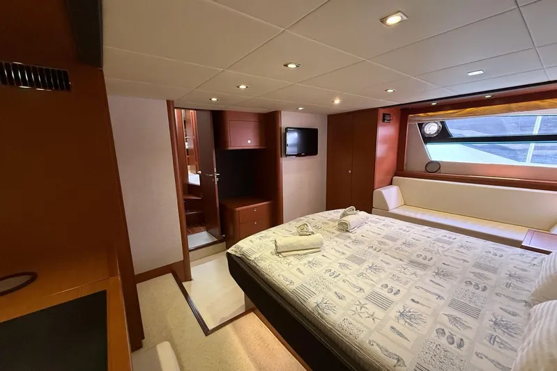  Yacht Photos Pics Luxurious cabin interior of 2011 Prestige 60 yacht with bed, seating, and window view.