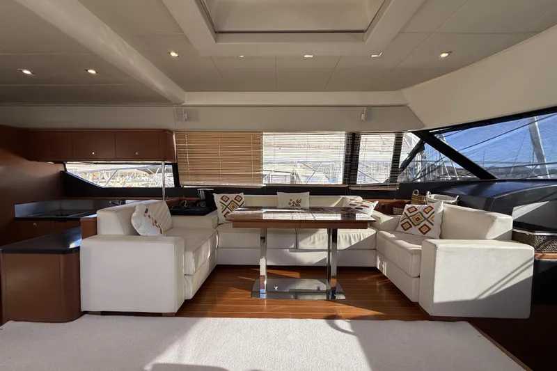 Yacht Photos Pics Luxurious interior of 2011 Prestige 60 yacht with elegant seating and wooden accents.