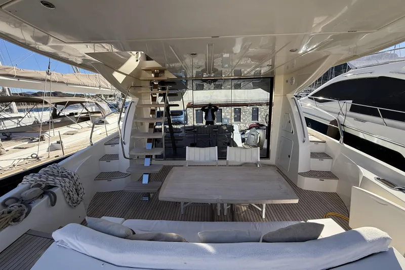  Yacht Photos Pics Luxurious 2011 Prestige 60 yacht interior with seating and table on deck.