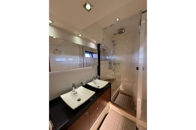  Yacht Photos Pics Luxurious bathroom in 2011 Prestige 60 yacht with dual sinks and modern shower.
