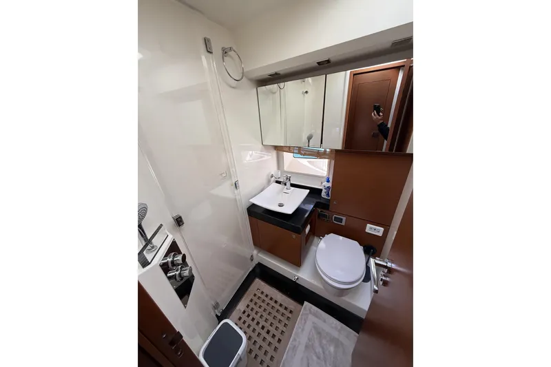  Yacht Photos Pics Luxurious bathroom in 2011 Prestige 60 yacht, featuring modern fixtures and elegant wood accents.