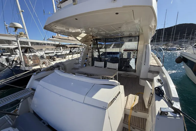  Yacht Photos Pics Luxury yacht Prestige 60, 2011 model, docked in a marina under clear blue skies.